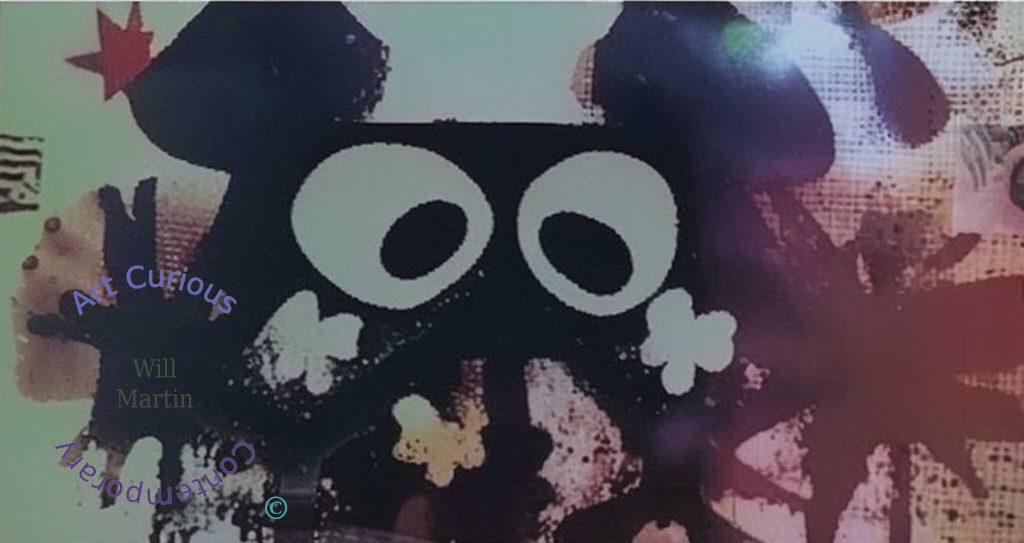 A black blot of a head fills a horizontal frame, carrying two large white oval eyes with dark irises. Pale clover-shaped forms flank it near the base, and a red star sits at upper left. The ground shifts from pale green at left through mottled rust and deep red at right, broken by scratches, speckle, and torn edges.
